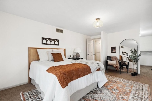 bedroom featuring baseboards, visible vents, and carpet flooring