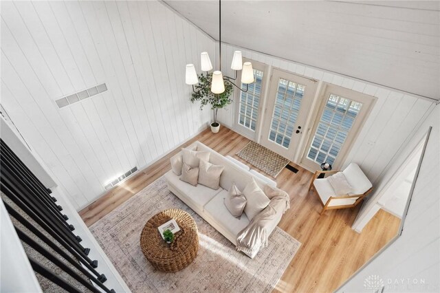 living room featuring hardwood / wood-style floors and a notable chandelier