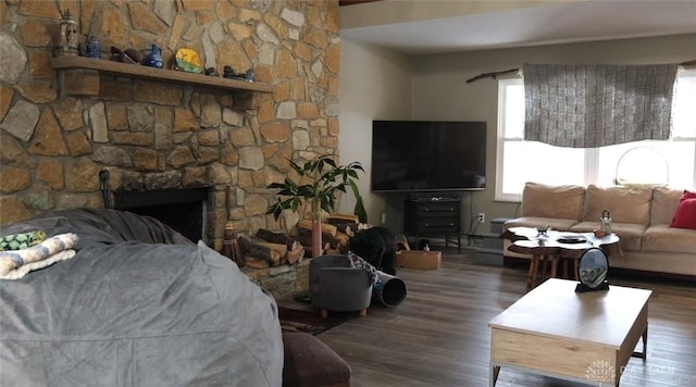 living room featuring hardwood / wood-style flooring and a fireplace