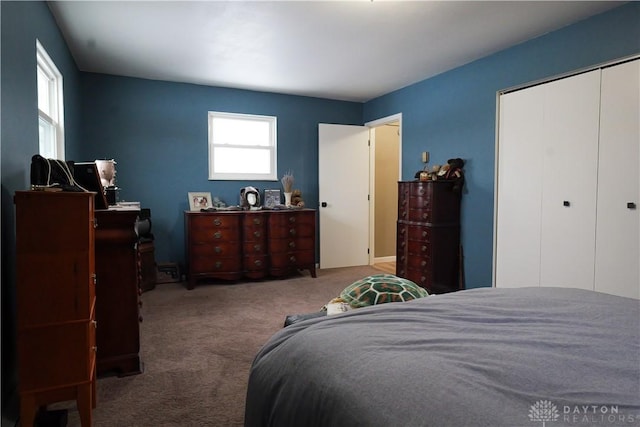 bedroom featuring a closet and carpet