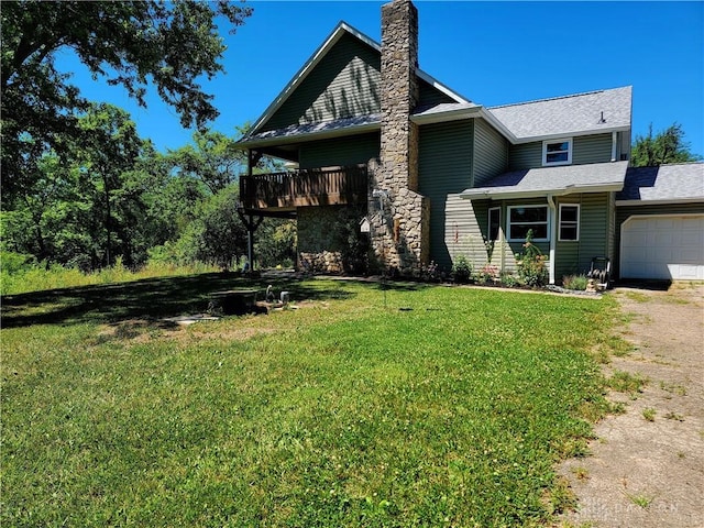 view of front of house featuring a garage and a front lawn