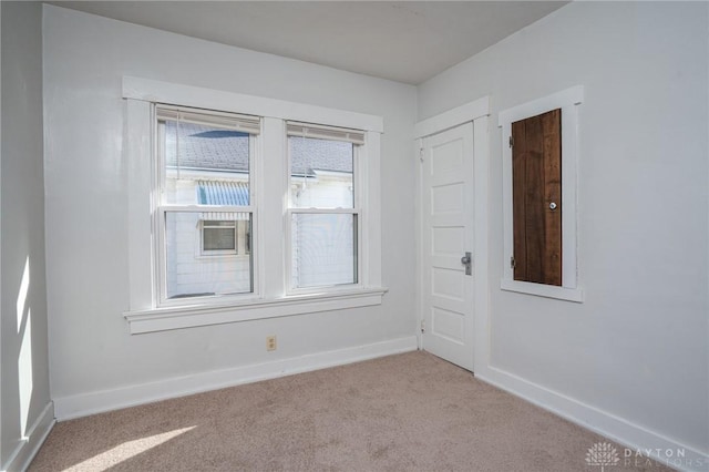 empty room with light colored carpet