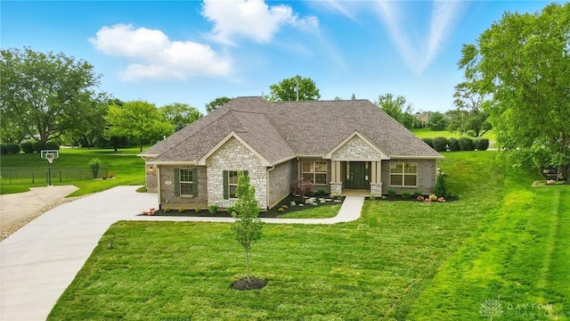300 Grassy Creek Way, Washington Twp, OH 45458 - craftsman-style house with stone siding, driveway, and a shingled roof