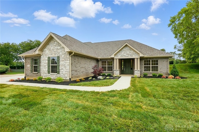 300 Grassy Creek Way, Washington Twp, OH 45458 - craftsman-style house with stone siding, a front lawn, and a shingled roof