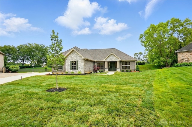 300 Grassy Creek Way, Washington Twp, OH 45458 - view of front of house featuring stone siding and a front lawn