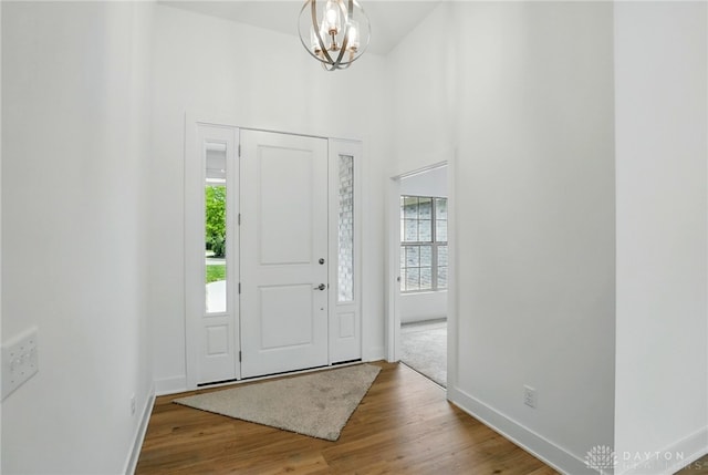 300 Grassy Creek Way, Washington Twp, OH 45458 - entryway with baseboards, wood finished floors, a chandelier, and a high ceiling