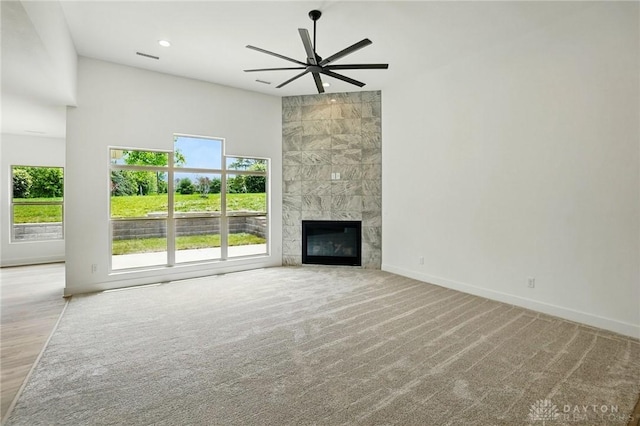 300 Grassy Creek Way, Washington Twp, OH 45458 - unfurnished living room featuring plenty of natural light, a ceiling fan, baseboards, a high end fireplace, and recessed lighting