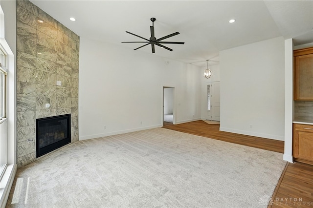 300 Grassy Creek Way, Washington Twp, OH 45458 - unfurnished living room featuring ceiling fan, a fireplace, baseboards, recessed lighting, and carpet floors
