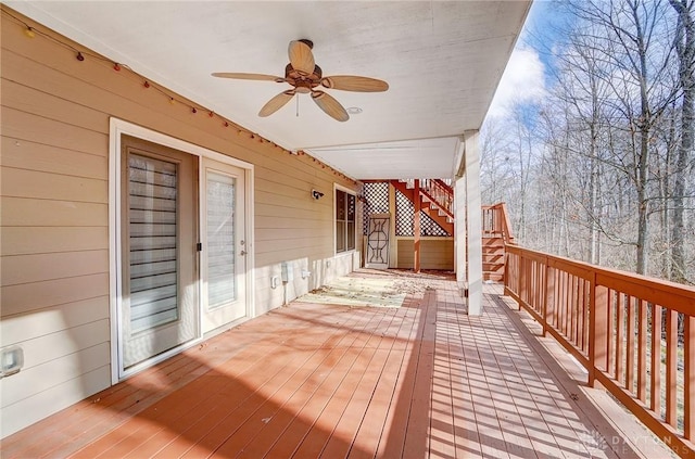 wooden terrace featuring ceiling fan