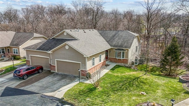 view of front of property featuring a garage and a front yard