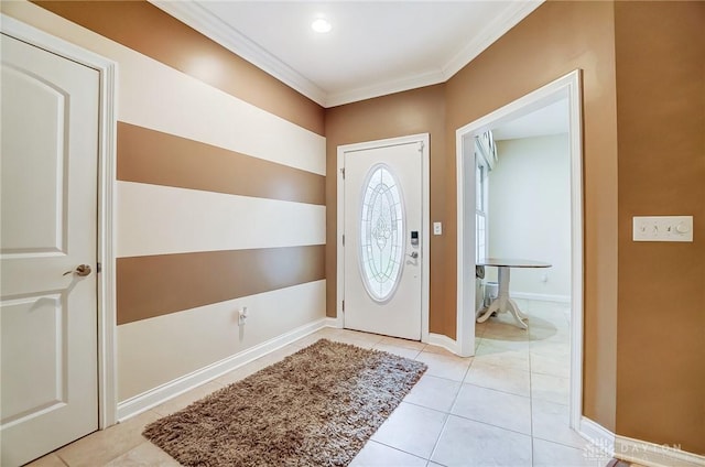 tiled foyer entrance featuring ornamental molding