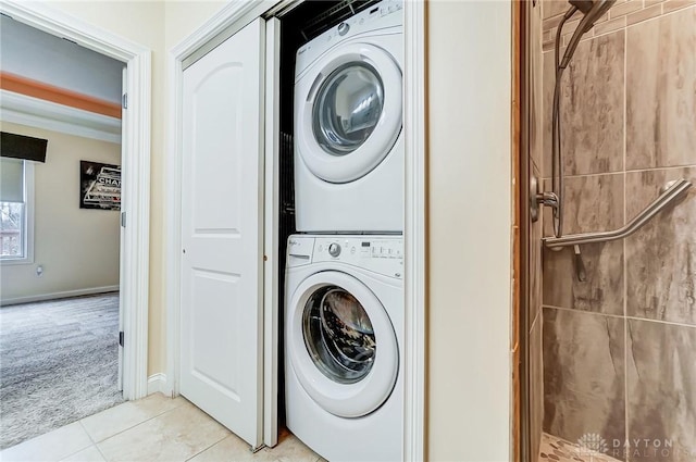 washroom with stacked washing maching and dryer and light carpet