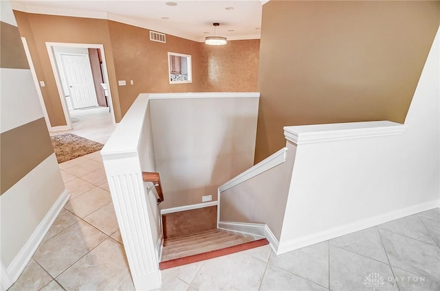 stairs featuring tile patterned flooring