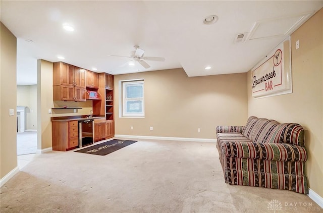 interior space with sink, light carpet, wine cooler, and ceiling fan