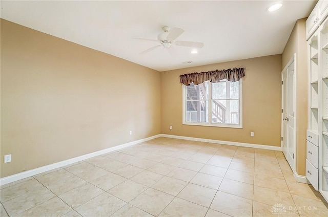 unfurnished bedroom featuring light tile patterned floors and ceiling fan