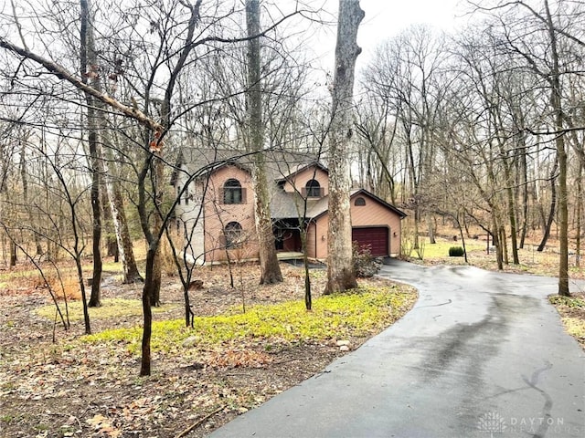 view of side of property with a garage