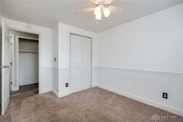 unfurnished bedroom with carpet floors, a closet, and ceiling fan