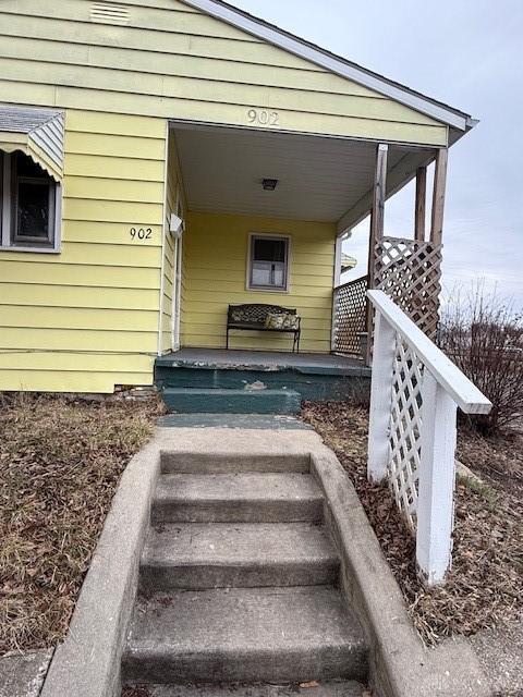 doorway to property with a porch