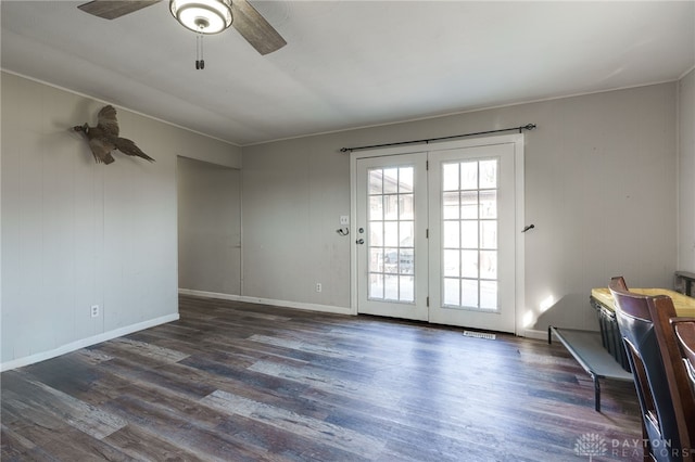 doorway featuring ceiling fan and dark hardwood / wood-style flooring