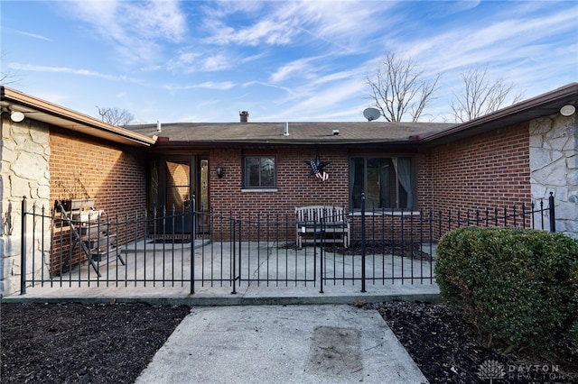 rear view of house with a patio