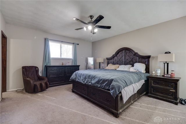 bedroom featuring ceiling fan and light carpet