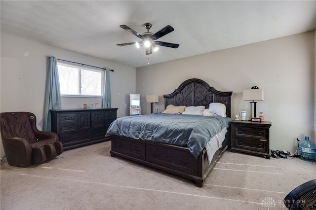 bedroom featuring light carpet and ceiling fan