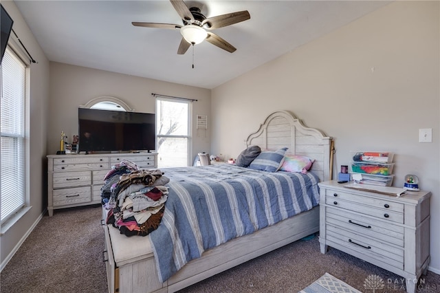 bedroom featuring ceiling fan and dark carpet