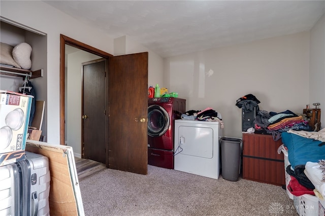 laundry room featuring light colored carpet and washing machine and clothes dryer