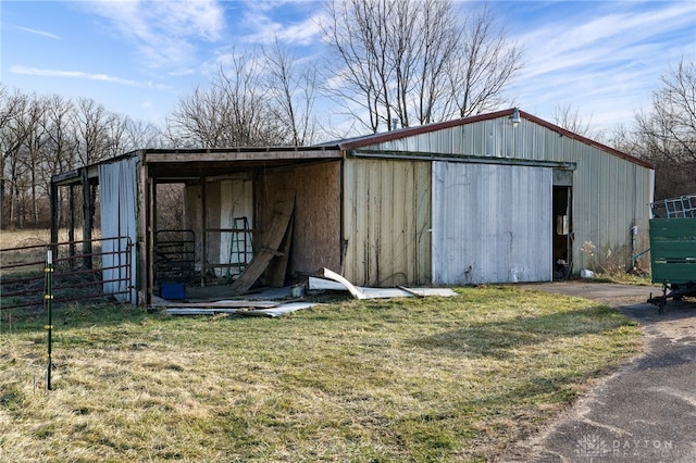 view of outdoor structure featuring a lawn