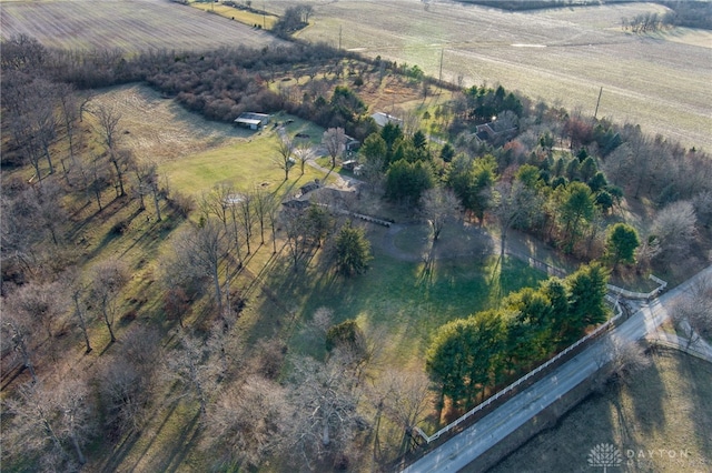 birds eye view of property with a rural view