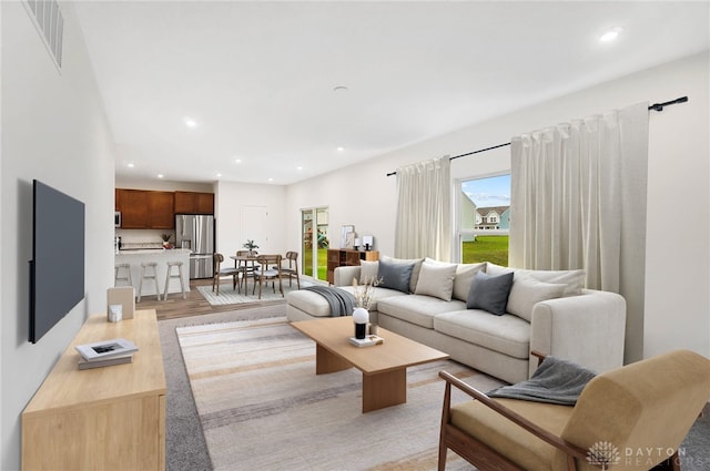 living room with light hardwood / wood-style flooring