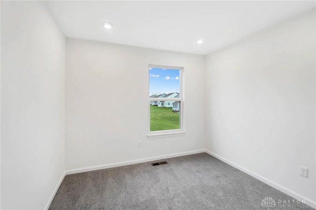 unfurnished room featuring carpet flooring