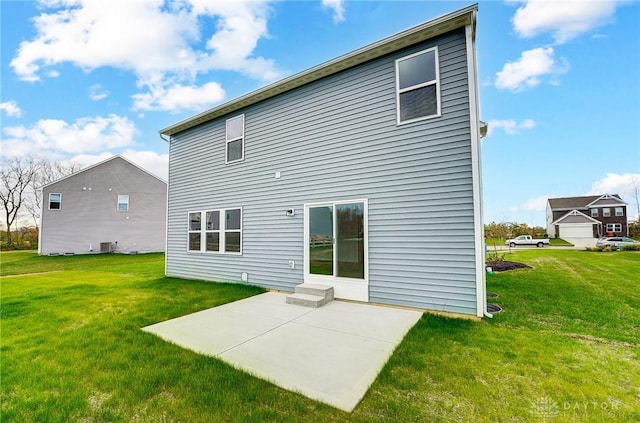 back of property featuring a yard and a patio