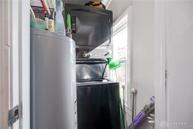 washroom with stacked washer / drying machine