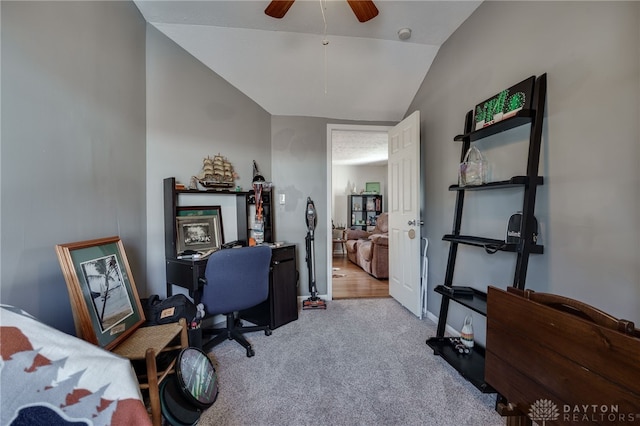 office space with light carpet, lofted ceiling, and ceiling fan