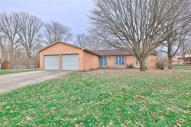 ranch-style house with a garage and a front lawn