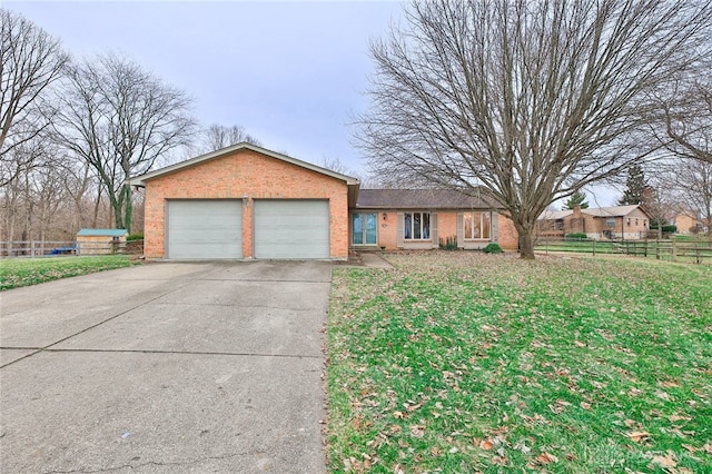 ranch-style house with a garage and a front yard