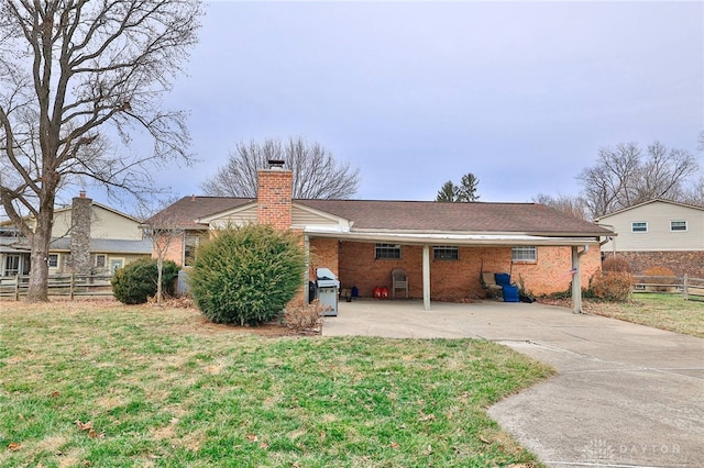 rear view of house with a lawn