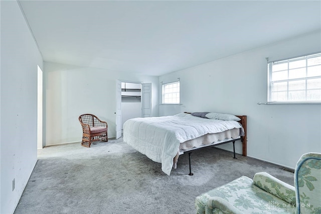 bedroom featuring light carpet