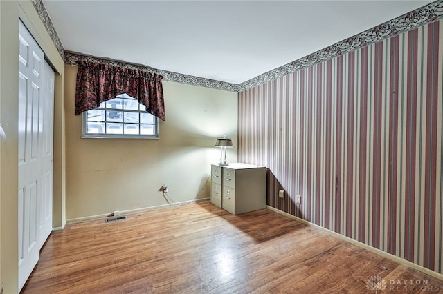 spare room with light hardwood / wood-style floors