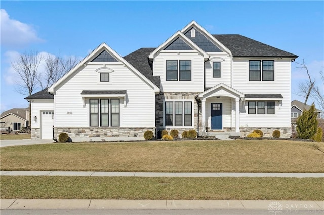 view of front of home featuring a garage and a front yard