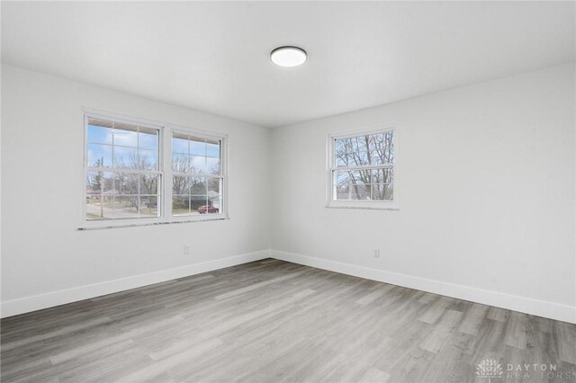 empty room featuring wood-type flooring