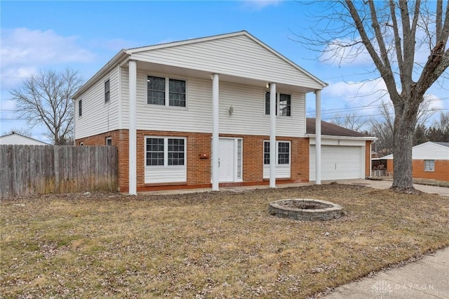 front of property featuring a garage and a fire pit