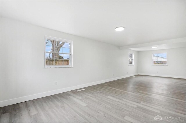 unfurnished room with light hardwood / wood-style floors