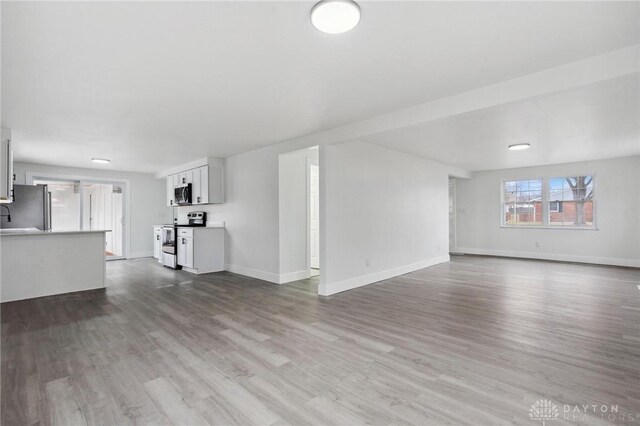 unfurnished living room featuring light wood-type flooring