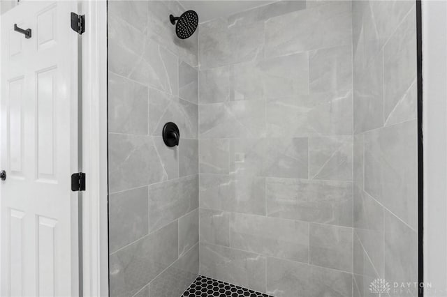 bathroom with a tile shower