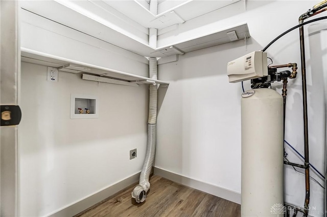 washroom featuring hookup for a washing machine, hardwood / wood-style floors, and electric dryer hookup