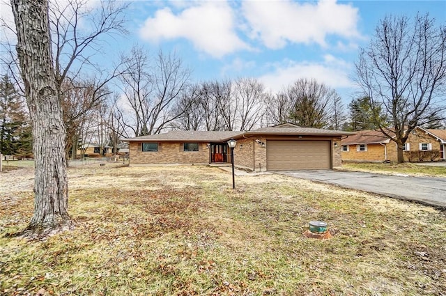 view of front of home with a garage and a front yard