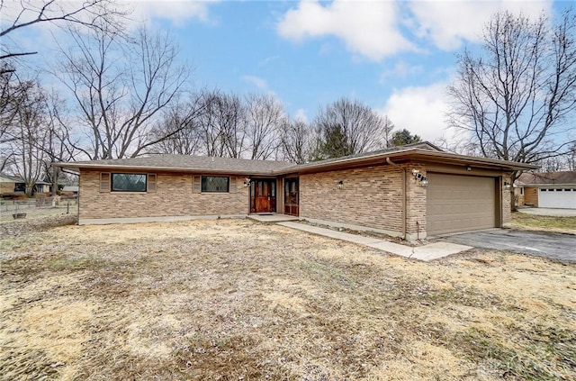 ranch-style home with a garage