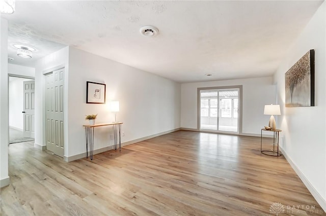 spare room featuring light hardwood / wood-style flooring